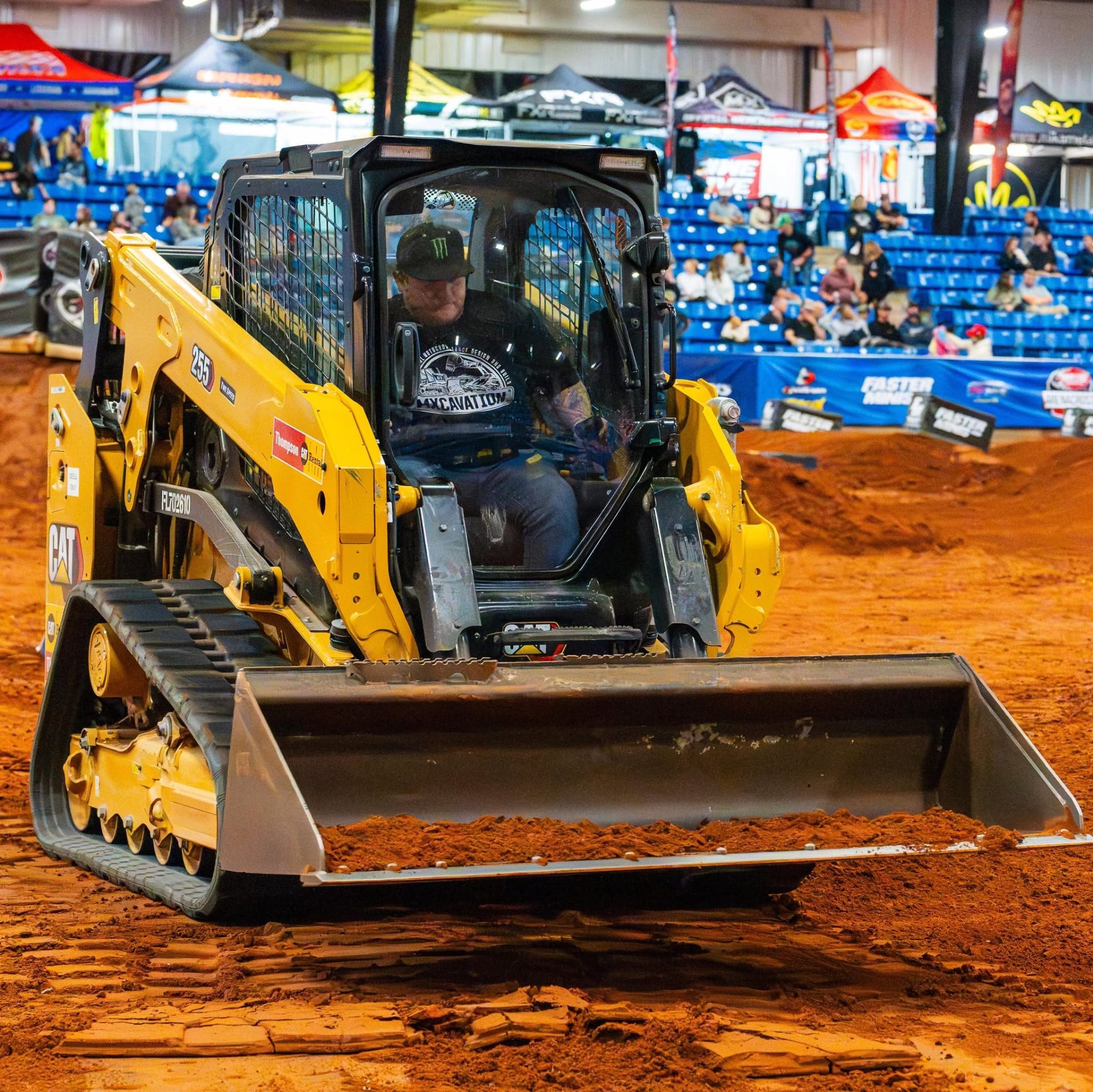 Sonny Leonti shaping race dirt from the cab of a tracked loader